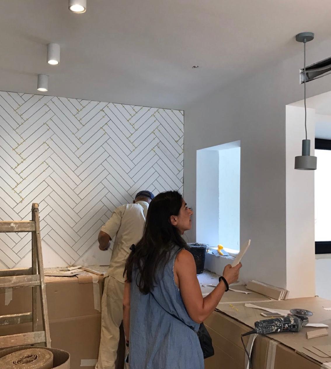 Lisa reviewing details during an interior installation