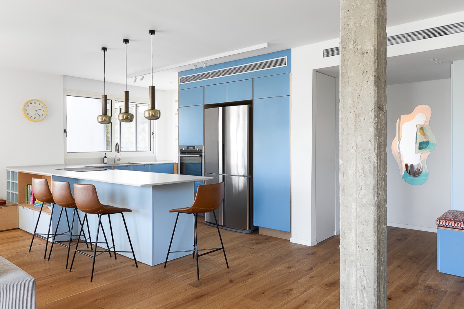 A bright blue kitchen designed by Lisa Sharabani